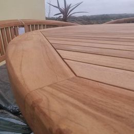 Teak garden dining table. 1.8m Titan round table with 4 bow wood style seats